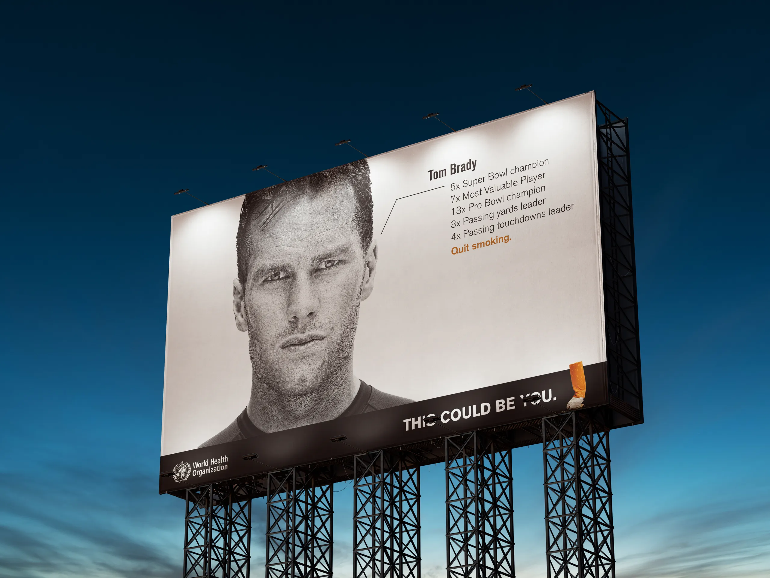 Black and white billboard of an American football quarterback, his list of titles ending in “Quit smoking,” and the line “This could be you.”